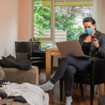 woman working at home with messy surroundings