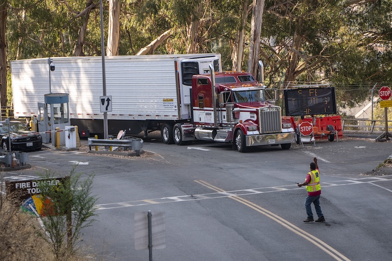 A truck is guided up Cyclotron Road to Shyh Wang Hall (Building 59) where the Cori computer system is being dismantled and removed by Hewlett Packard Enterprise (HPE), at Lawrence Berkeley National Laboratory (Berkeley Lab), 08/23/2023. Cori was the National Energy Research Scientific Computing Center’s (NERSC) longest-running system, commissioned in 2015, before being replaced by the Perlmutter system in 2023.