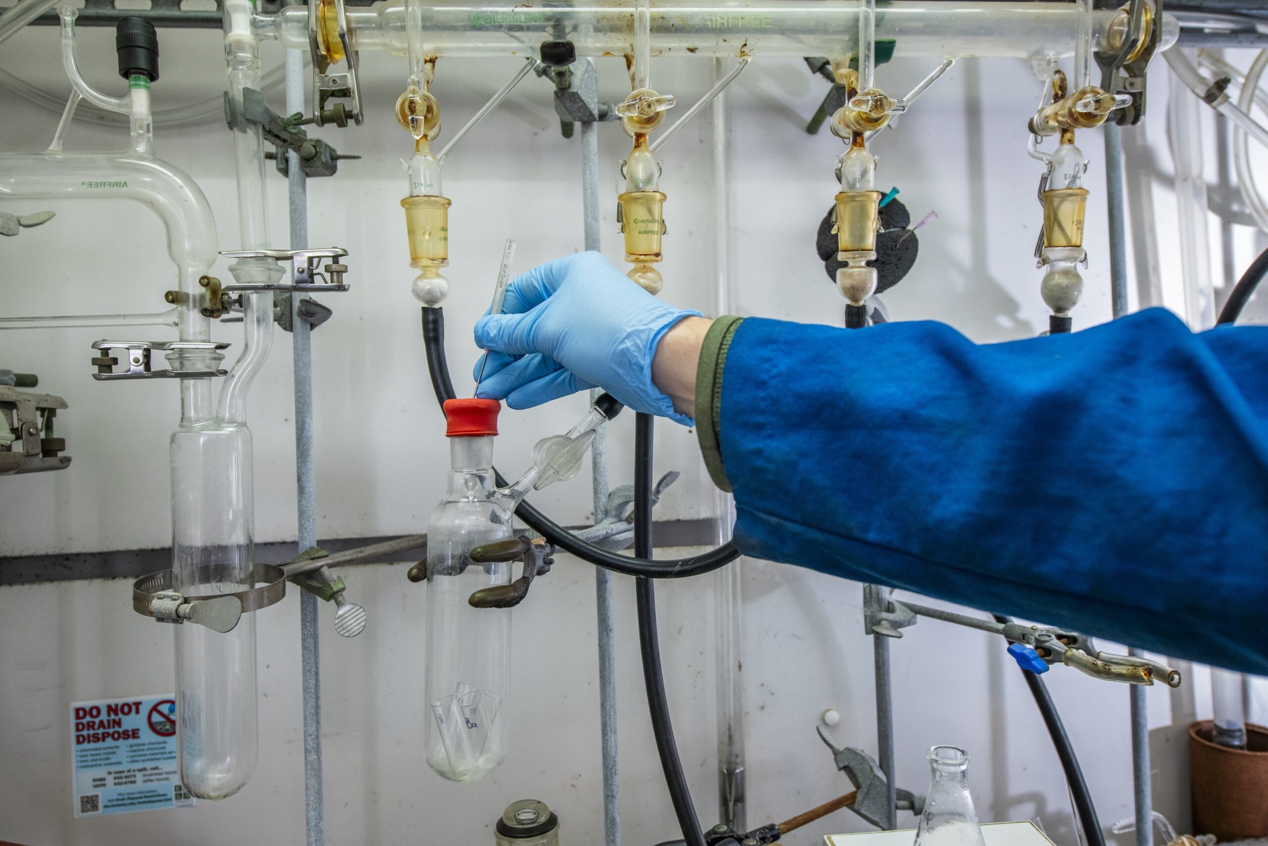 NextGen nonproliferation leadership development program fellow Joe Brackbill works with chemicals inside a fume hood at the Latimer 520 Laboratory at UC Berkeley, 02/03/2025. Brackbill’s research is tackling problems related to the safety of advanced nuclear reactions. He is part of cohort 2 of the NextGen program.